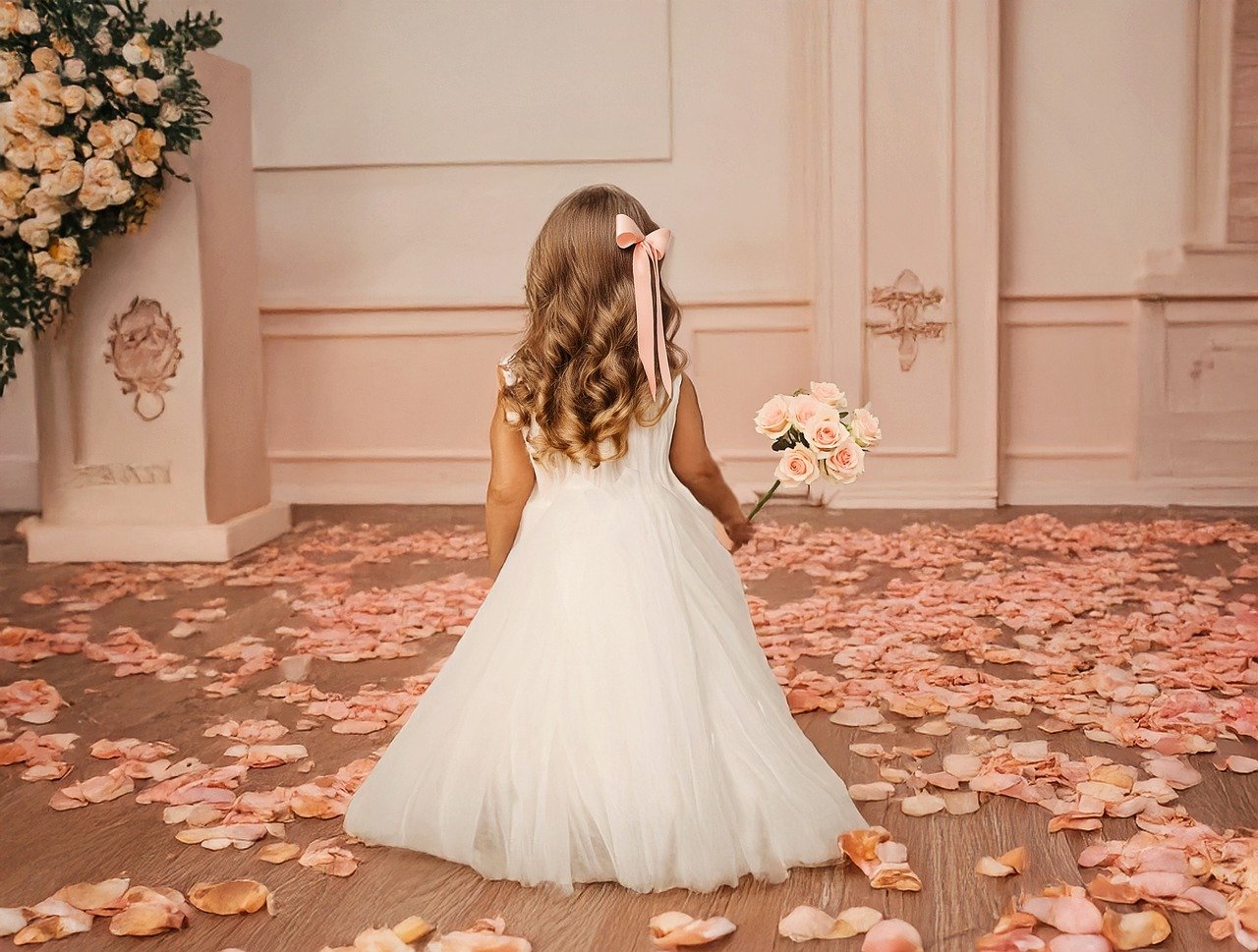 about-us flower girl, wedding, little girl, toddler girl in wedding, dressed up, dressy, wedding hall